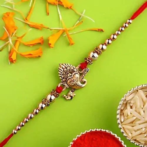 Auspicious Ganesha Rakhi and Dairy Milk Silk Chocolates