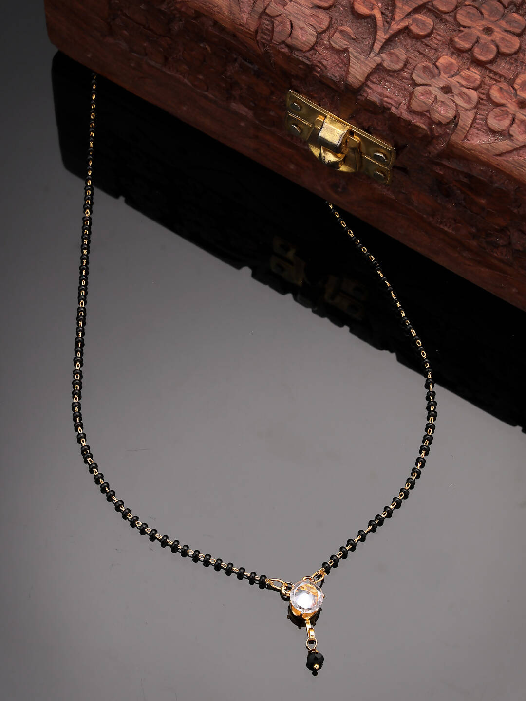 NVR Women Ethnic Gold-Polished Beaded Mangalsutra With Ad Stone