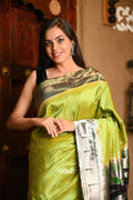 Very Much Indian Premium Handloom Pure Silk Muniya Borde-Parrot Green,Silver Zari And Intricate Big Radha Krishna Pallu