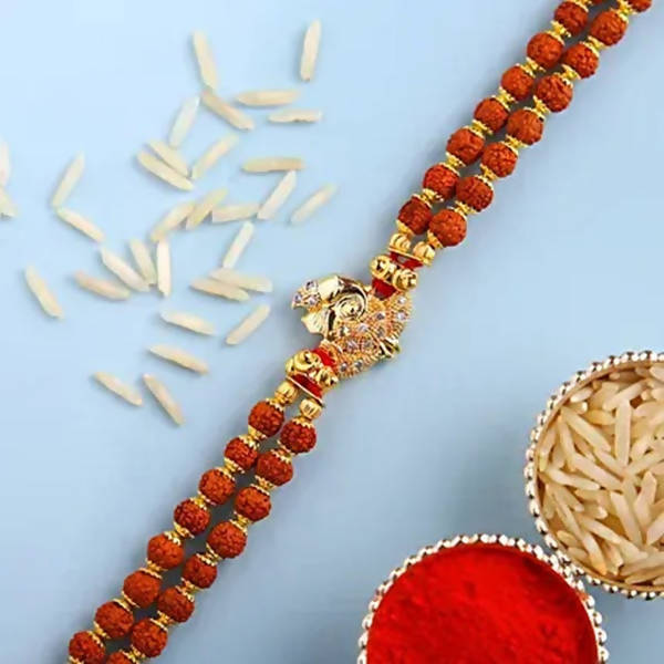 Ganesha Minimal Style Rakhi And Cadbury Silk Chocolates