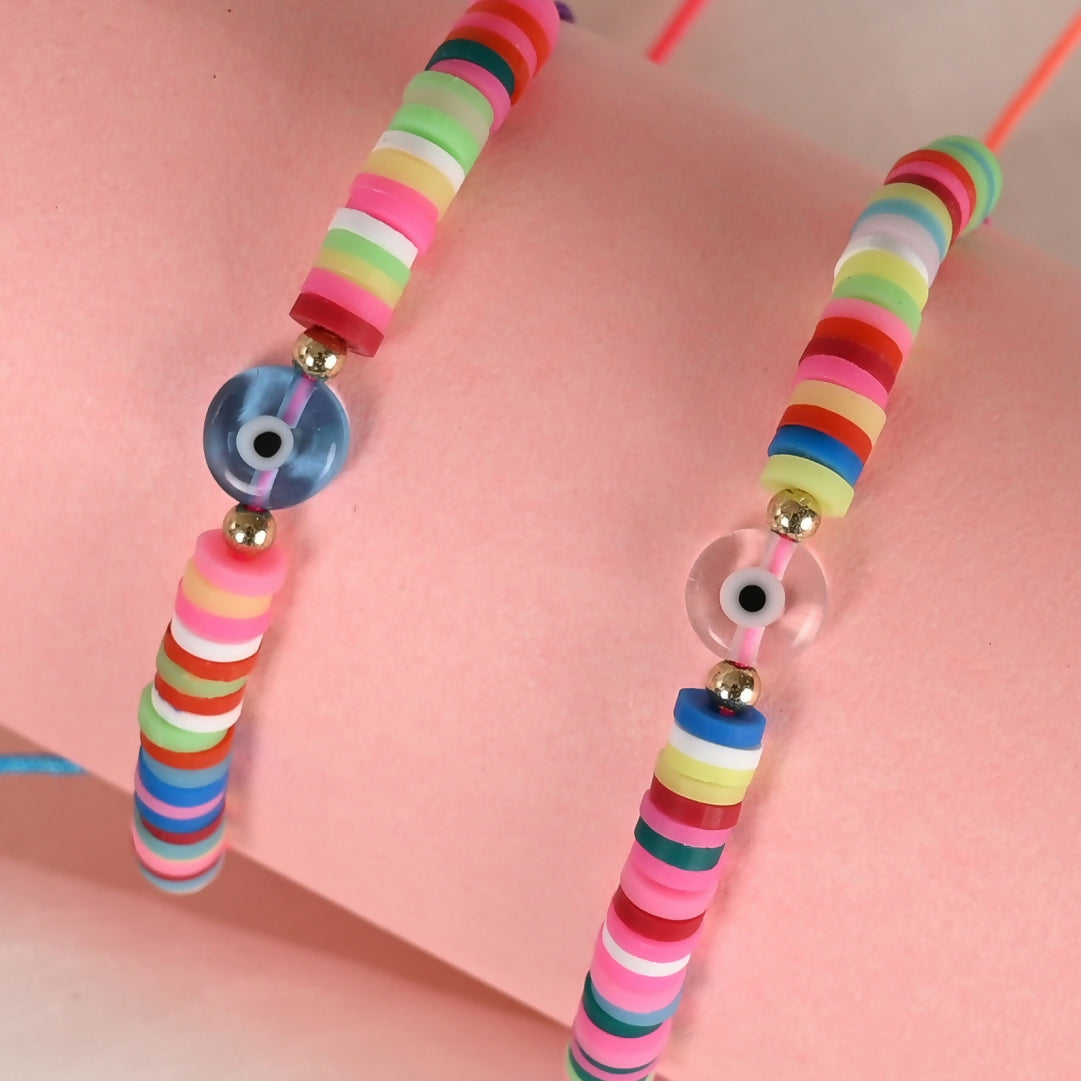 NVR Women & Men Set of 2 Multicolor Evil Eye Rakhi With Roli Chawal