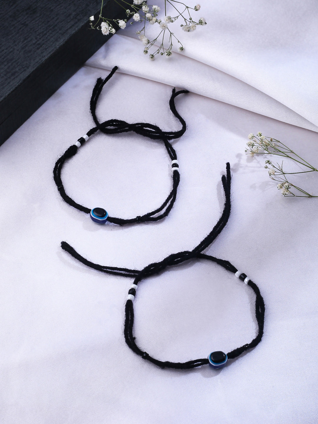 NVR Women & Men Set of 2 Black Evil Eye Rakhi With Roli Chawal