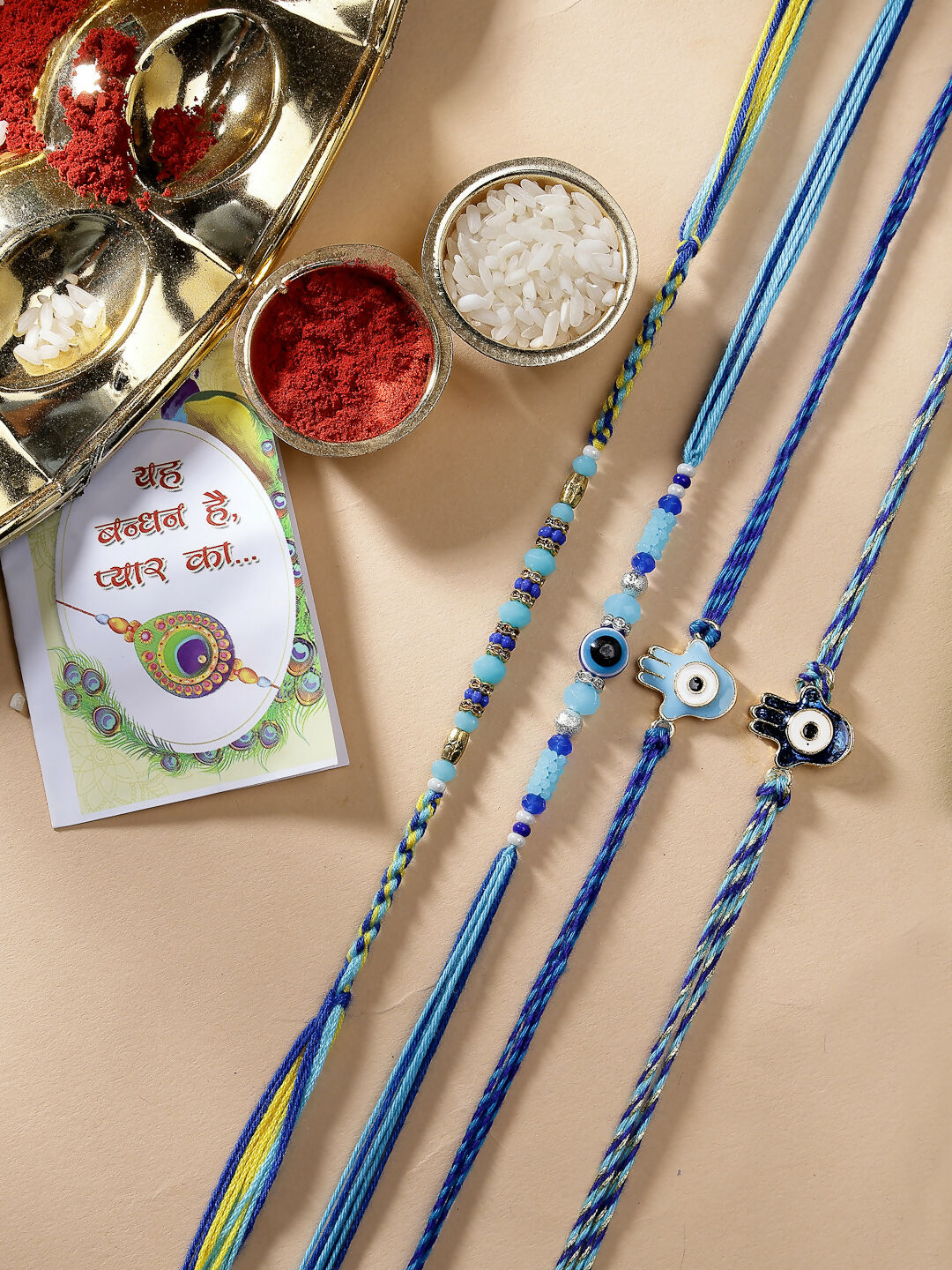 NVR Women & Men Set of 4 Blue Evil Eye Charm Rakhi With Roli Chawal & Chocolate