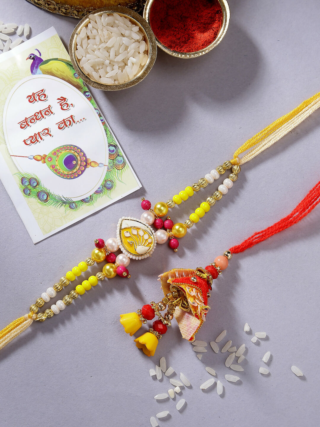 NVR Women & Men Set of 2 Yellow Peacock Design Bhaiya Bhabhi Rakhi With Roli Chawal