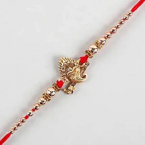 Auspicious Ganesha Rakhi And Kaju Rolls Box