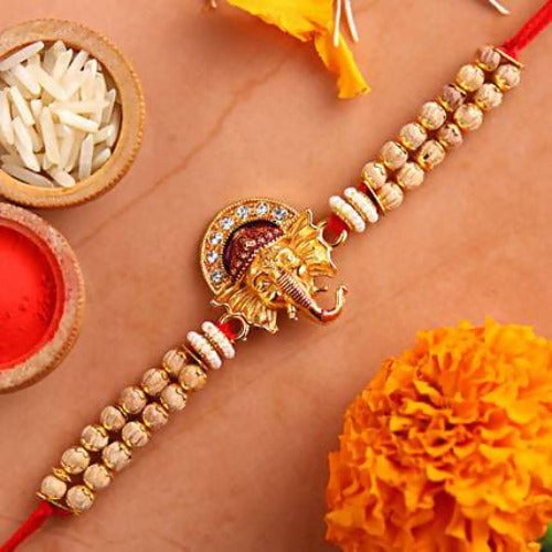 Beautiful Ganesha Rakhi and Kaju Rolls Box
