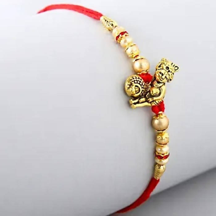 Divine Lord Krishna Pearl Rakhi & Cashew Jar