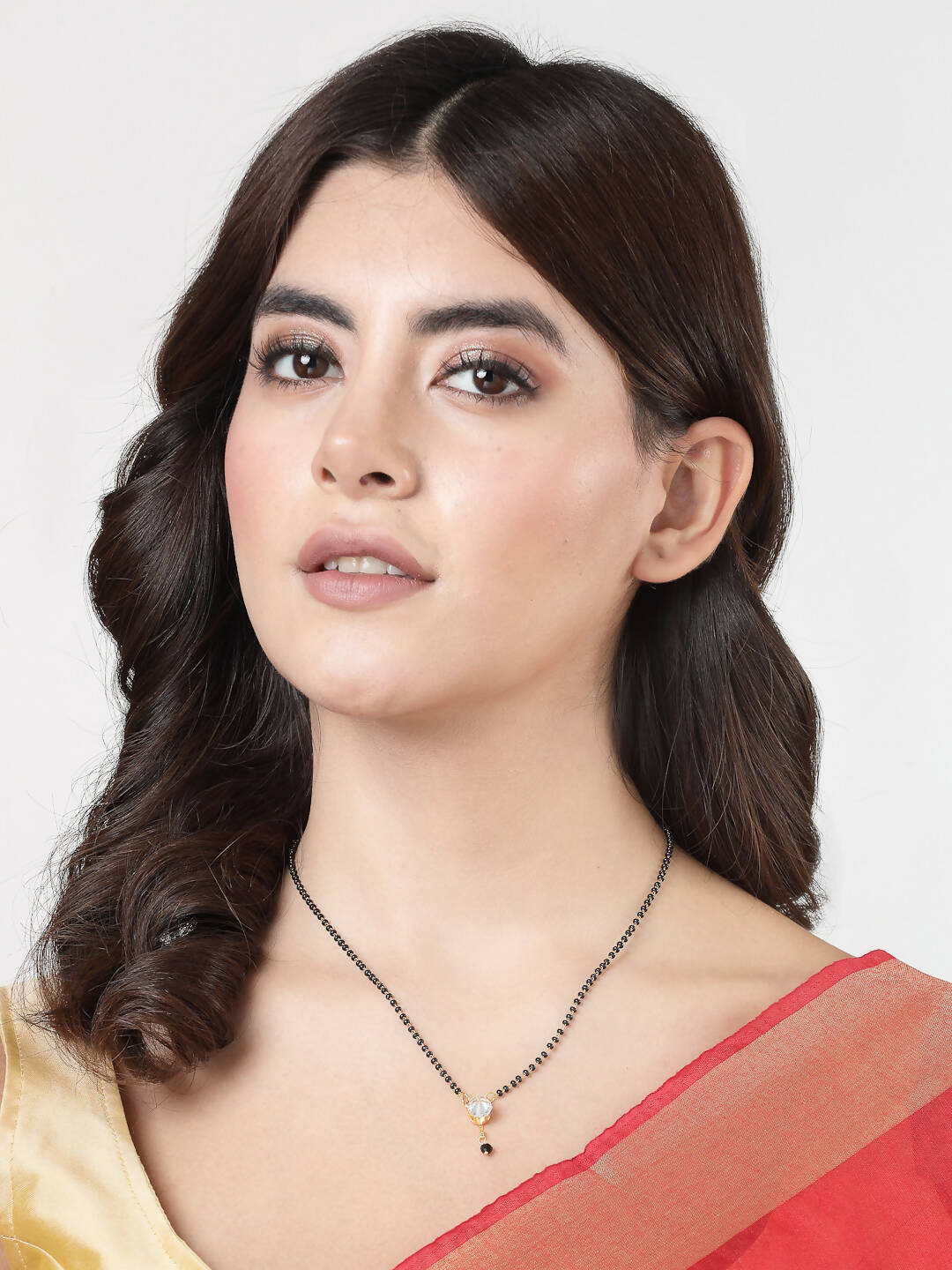 NVR Women Ethnic Gold-Polished Beaded Mangalsutra With Ad Stone