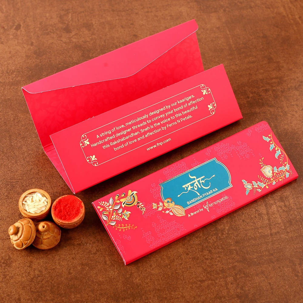 Pretty Rudraksha Rakhi And Cashew Jar