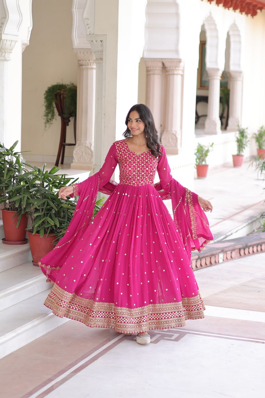 Evanik Rani Pink Faux Georgette with Rich Sequins & Zari Embroidered work Gown