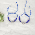 NVR Women & Men Set of 2 Blue Evil Eye Rakhi With Roli Chawal