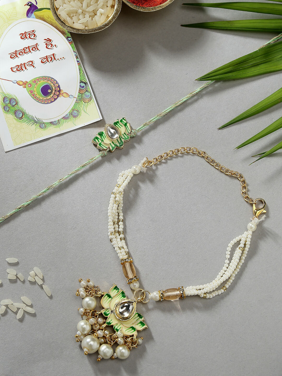 NVR Women & Men Set of 2 Green Lotus Shape Kundan-Studded & Beaded Handcrafted Wraparound Rakhi Set With Roli Chawal