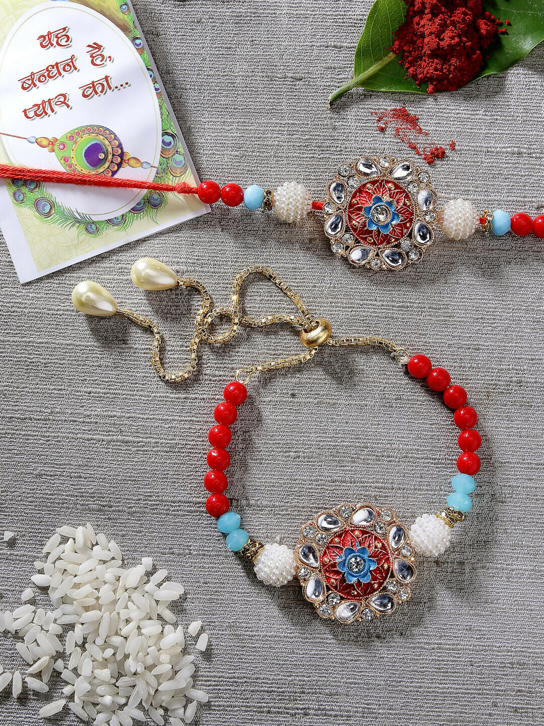 NVR Women & Men Set of 2 Red-colored Stone-Studded & Beaded Bhaiya Bhabhi Rakhi With Roli Chawal & Chocolate